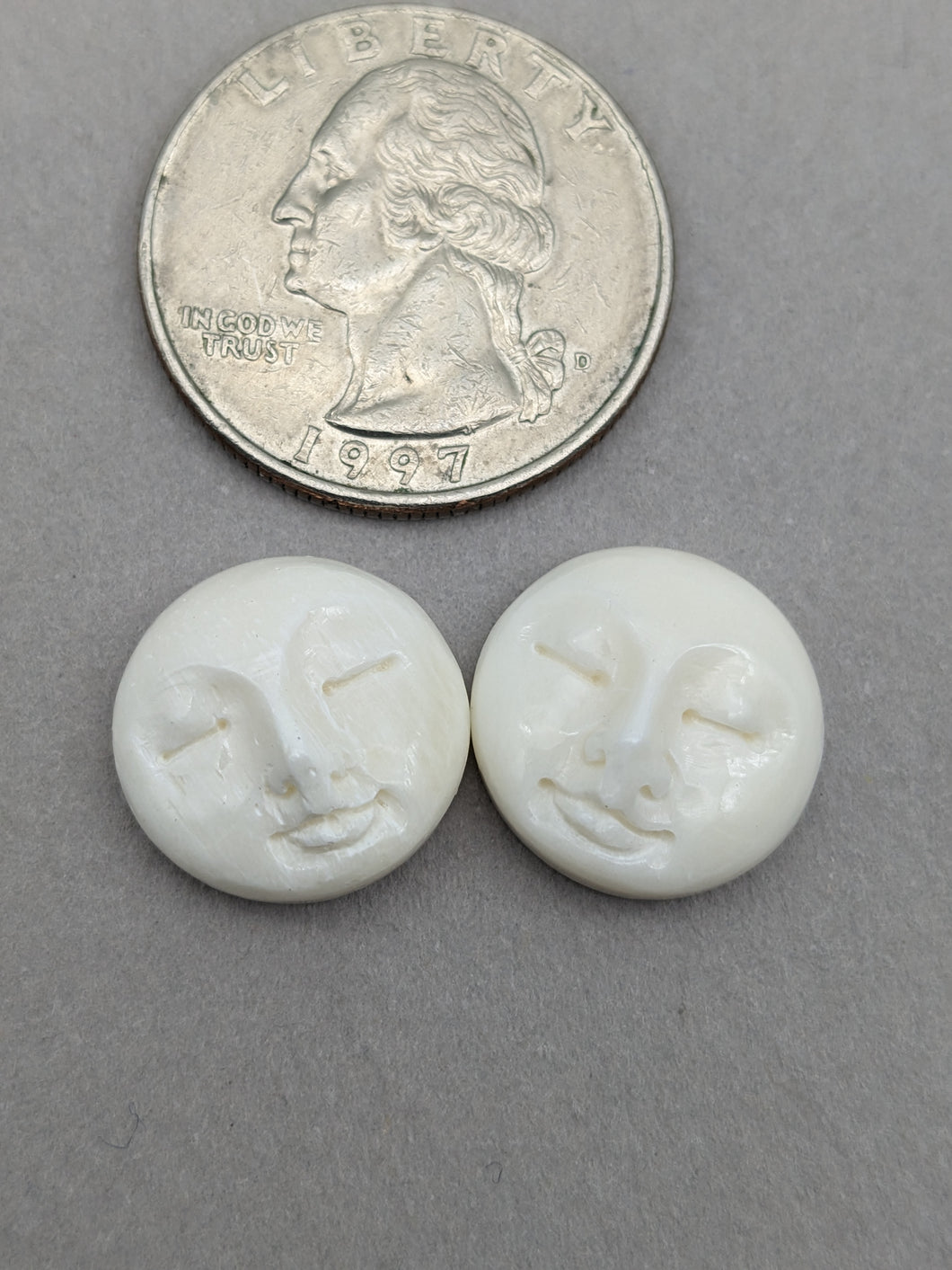 Carved bone - moon face pairs